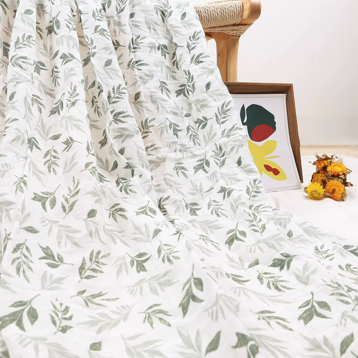Two-layer cotton muslin swaddle in a dainty floral print