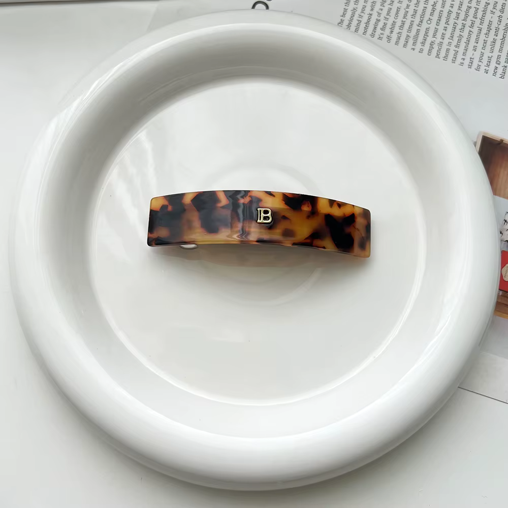 Acetate barrette with gold B detail – AW26